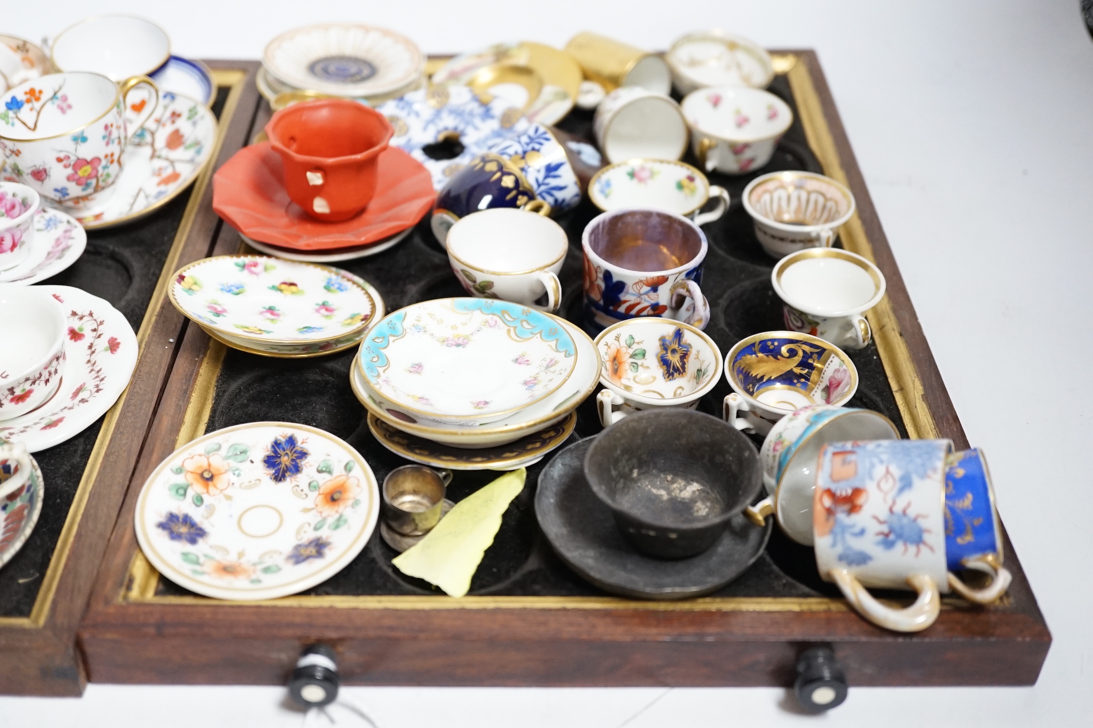 Collection of miniature porcelain cups and saucers including Spode, Royal Crown Derby and Coalport